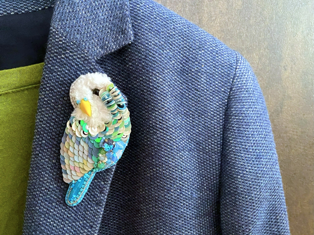 Handmade brooch in the shape of an azure blue wavy parrot made from beads and sequins - Ornamentico shop