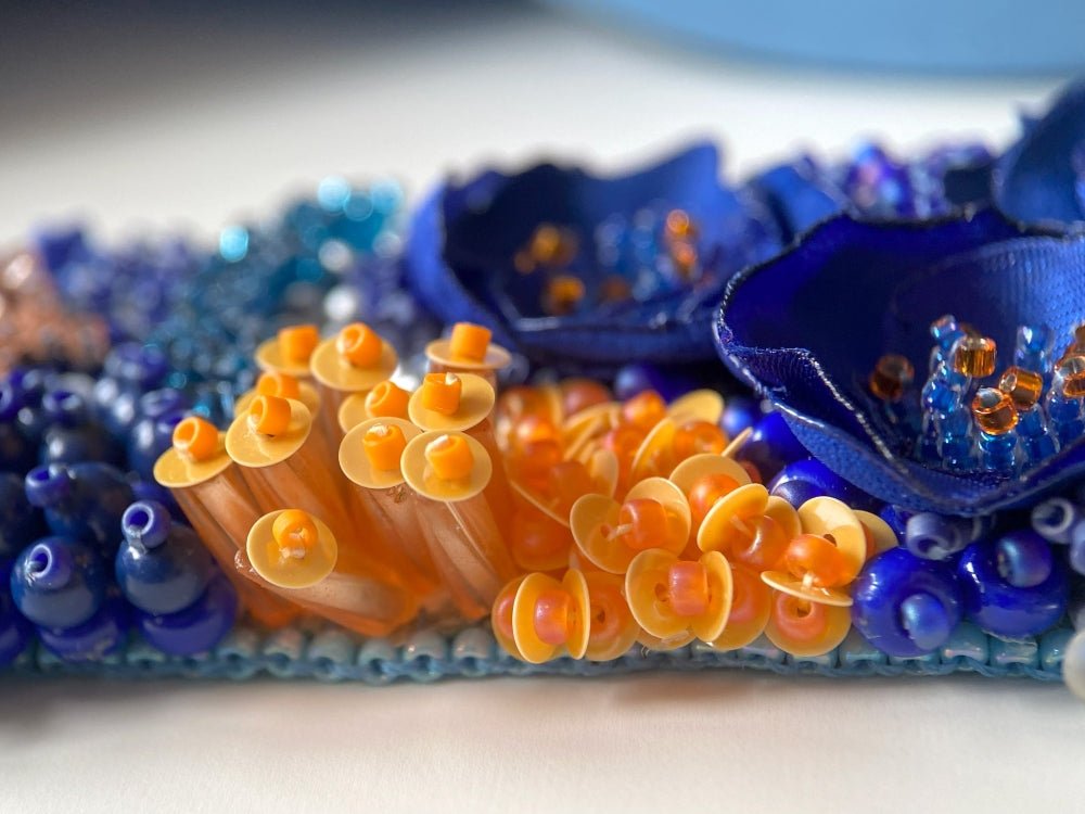 Exclusive statement volume-beaded bracelet in deep blue, orange and matte silver hues crafted from beads, sequins, textile and natural stones - Ornamentico shop