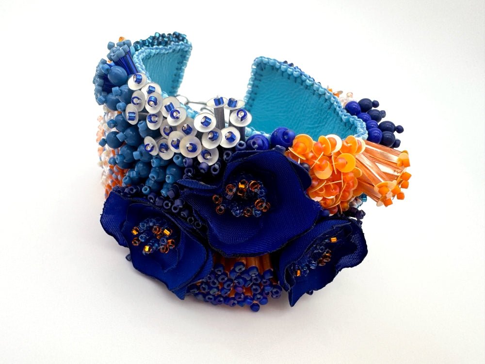 Exclusive statement volume-beaded bracelet in deep blue, orange and matte silver hues crafted from beads, sequins, textile and natural stones - Ornamentico shop