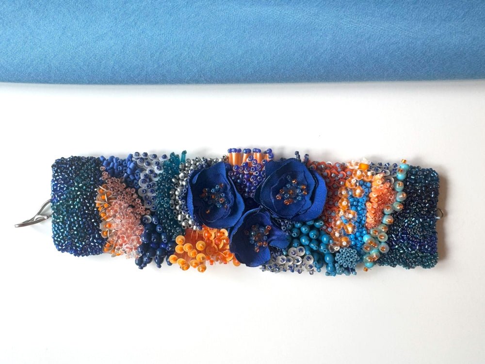 Exclusive statement volume-beaded bracelet in deep blue, orange and matte silver hues crafted from beads, sequins, textile and natural stones - Ornamentico shop