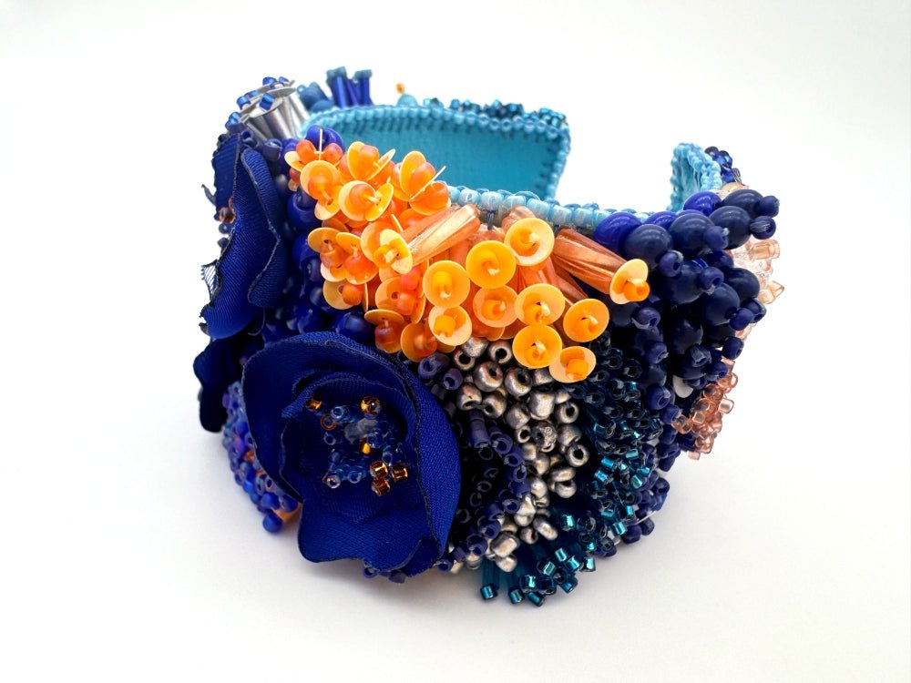 Exclusive statement volume-beaded bracelet in deep blue, orange and matte silver hues crafted from beads, sequins, textile and natural stones - Ornamentico shop