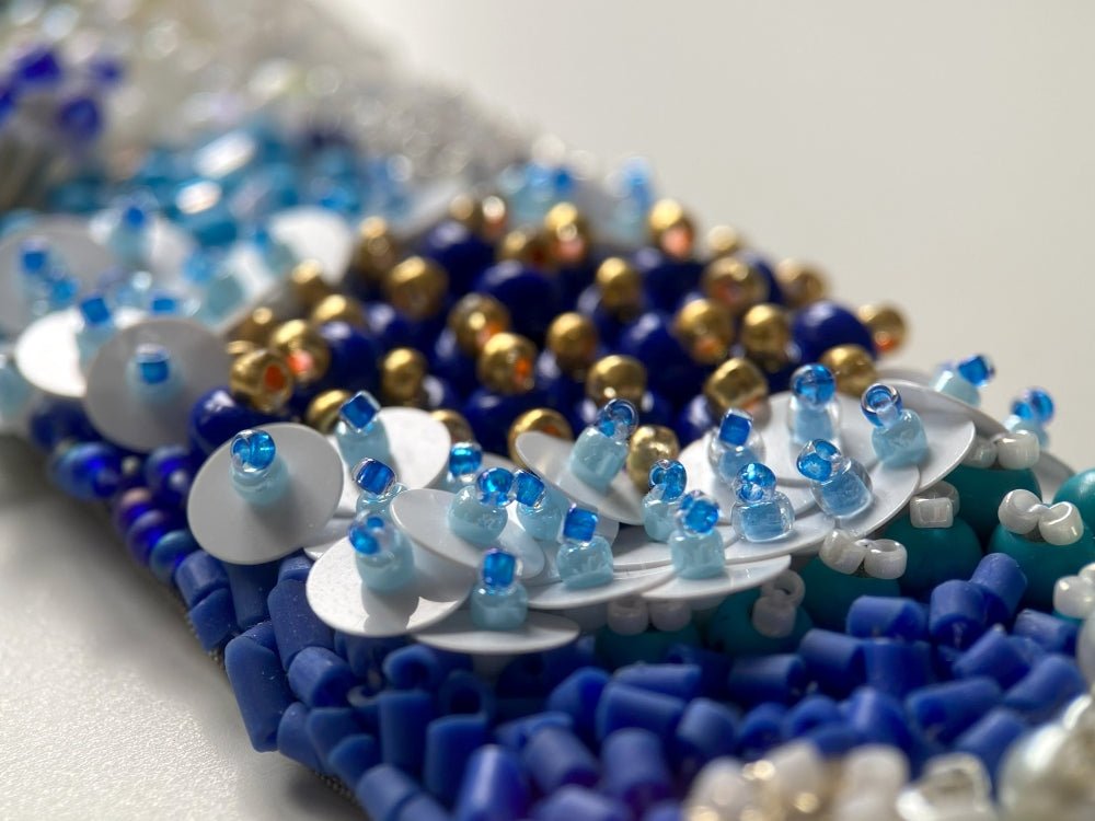 Exclusive handmade bracelet crafted from beads, sequins and rhinestones in a variety of blue and white hues using volume-beading technique - Ornamentico shop