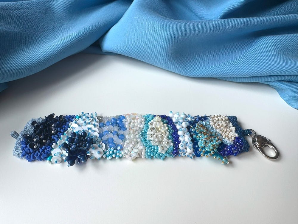 Exclusive handmade bracelet crafted from beads, sequins and rhinestones in a variety of blue and white hues using volume-beading technique - Ornamentico shop
