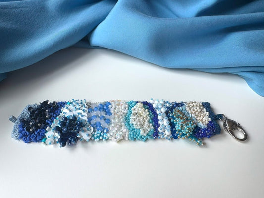 Exclusive handmade bracelet crafted from beads, sequins and rhinestones in a variety of blue and white hues using volume-beading technique - Ornamentico shop