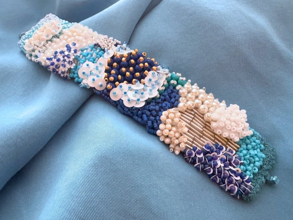 Exclusive handmade bracelet crafted from beads, sequins and rhinestones in a variety of blue and white hues using volume-beading technique - Ornamentico shop