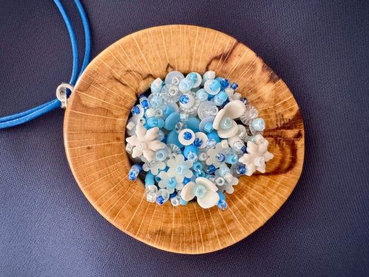 Exclusive wooden pendant with volume-beaded inlay crafted in floral motif using light blue and white hues - Ornamentico shop