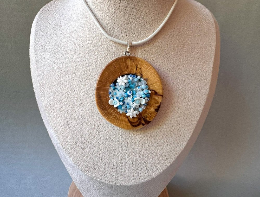 Exclusive wooden pendant with volume-beaded inlay crafted in floral motif using light blue and white hues - Ornamentico shop