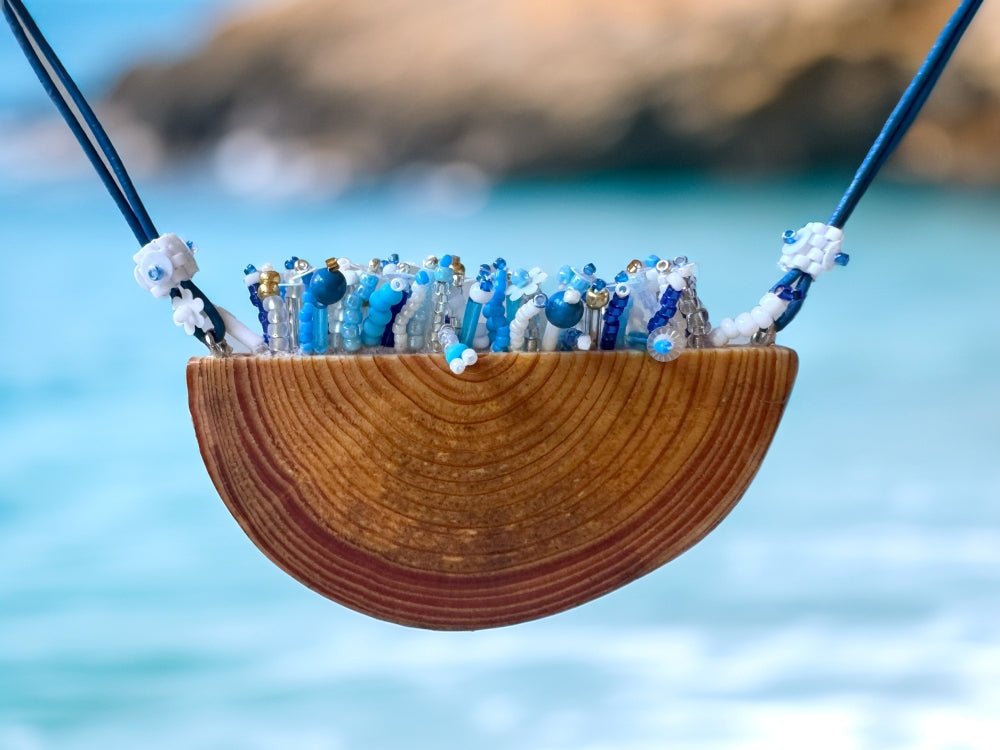 Exclusive wooden pendant with embedded beaded element imitating flowerbed with various hues of blue and white - Ornamentico shop