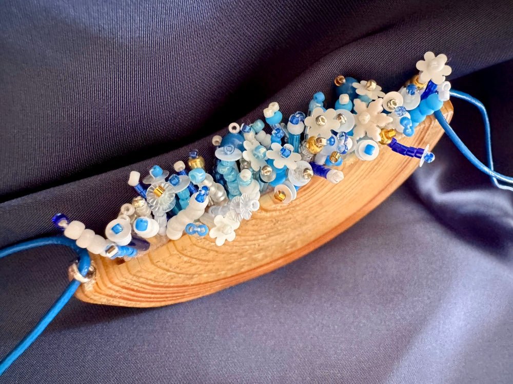 Exclusive wooden pendant with embedded beaded element imitating flowerbed with various hues of blue and white - Ornamentico shop