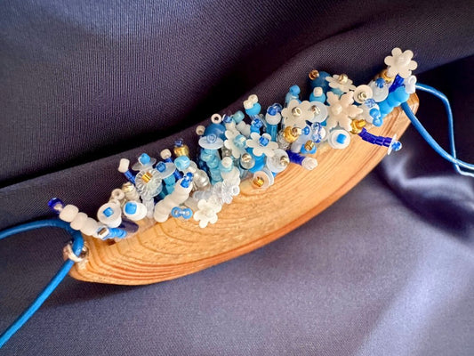 Exclusive wooden pendant with embedded beaded element imitating flowerbed with various hues of blue and white - Ornamentico shop