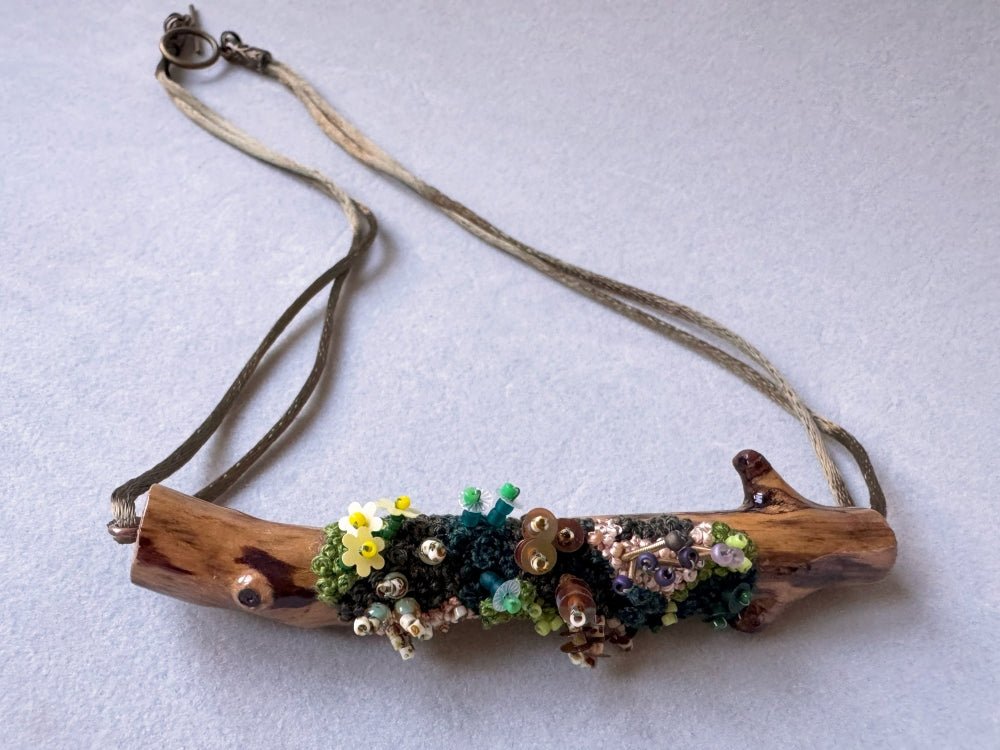 Exclusive wooden pendant decorated by the embroidered and volume-beaded element imitating moss - Ornamentico shop
