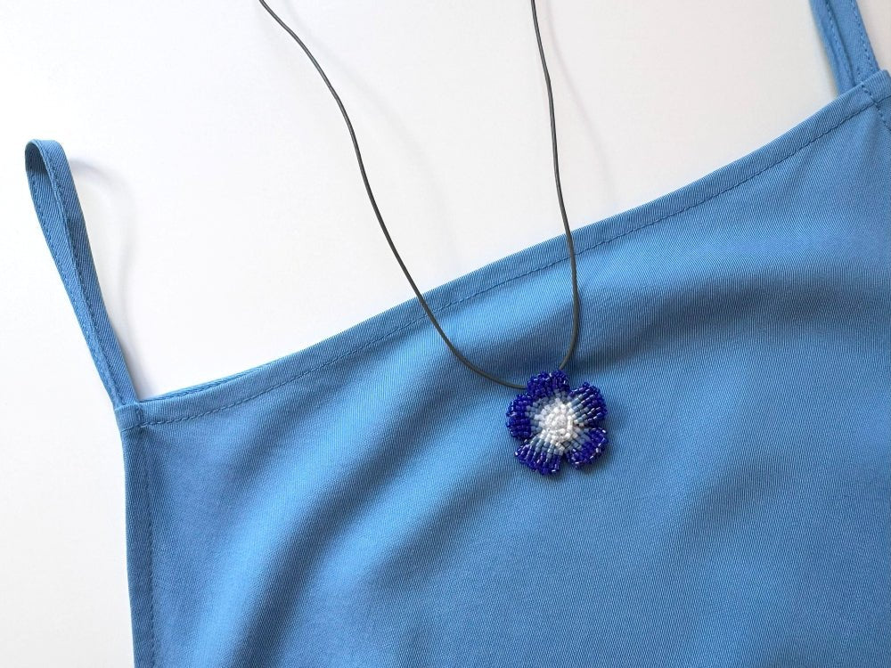 Handmade 360° blue beaded pendant inspired by blue clematis. Indigo to crystal tones, with leather cord - Ornamentico shop