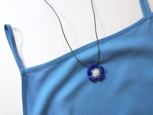 Handmade 360° blue beaded pendant inspired by blue clematis. Indigo to crystal tones, with leather cord - Ornamentico shop