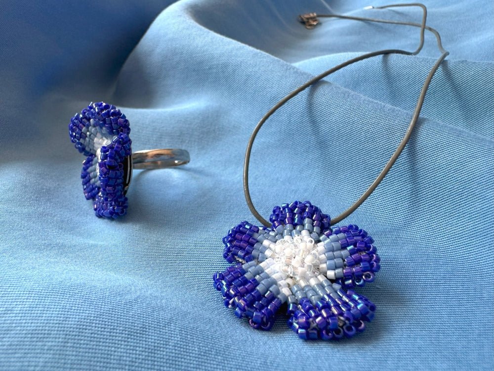 Handmade 360° beaded pendant inspired by blue clematis. Indigo to crystal tones, with leather cord - Ornamentico shop