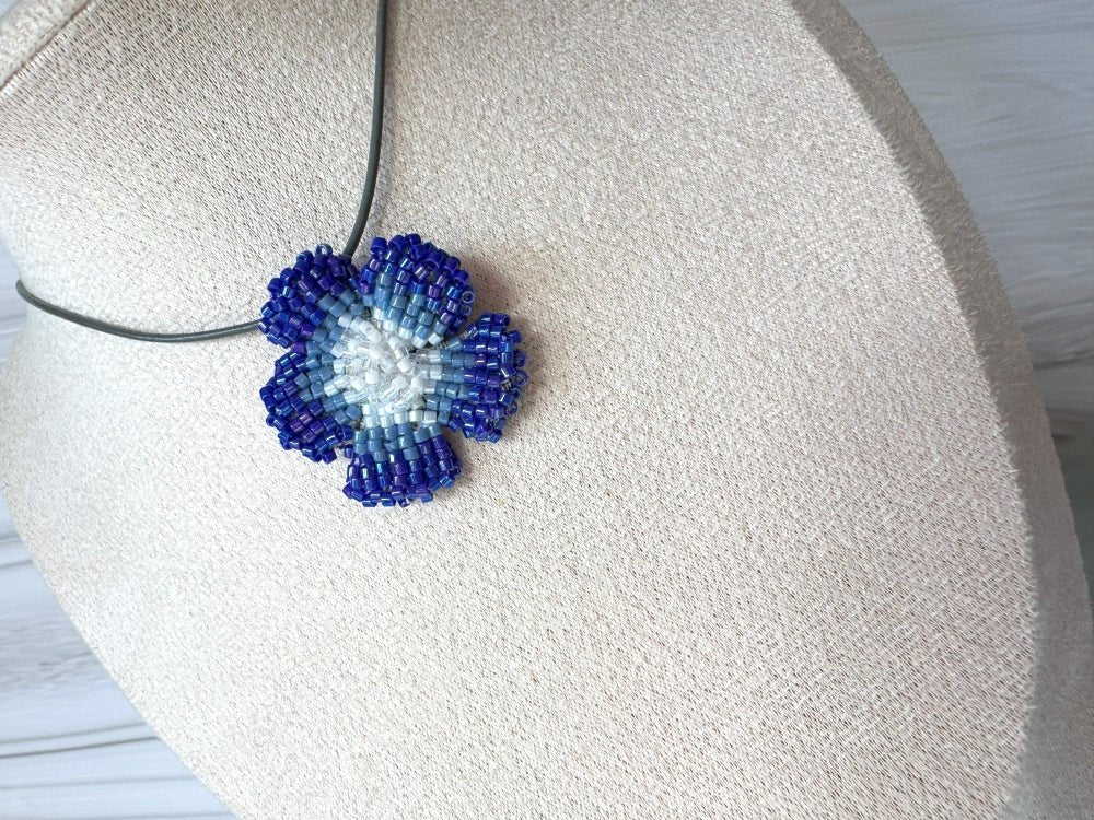 Handmade 360° beaded pendant inspired by blue clematis. Indigo to crystal tones, with leather cord - Ornamentico shop