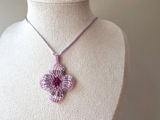 Sculptural floral pendant in soft pink to burgundy tones. Hand-beaded rosette design with silk cord - Ornamentico shop