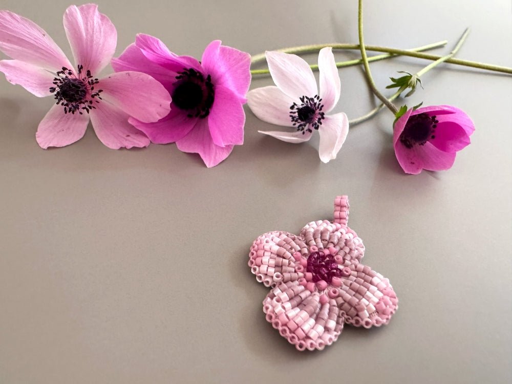 Sculptural floral pendant in soft pink to burgundy tones. Hand-beaded rosette design with silk cord - Ornamentico shop