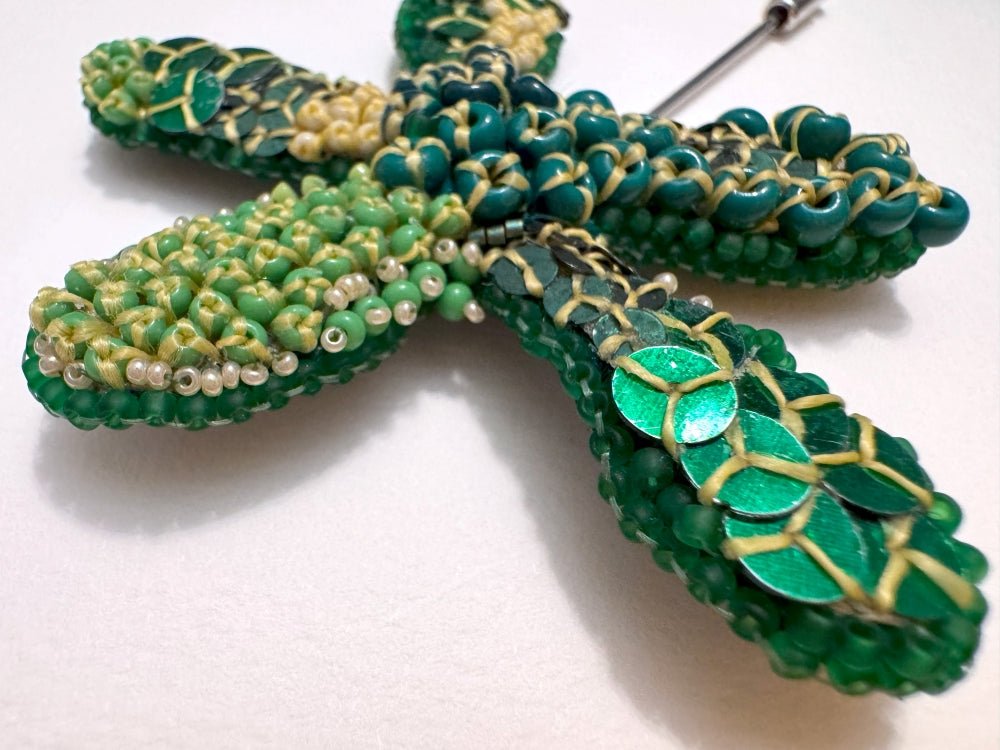 Sculptural handmade brooch inspired by organic forms created with free-flow beadwork in layered greens with yellow accents - Ornamentico shop