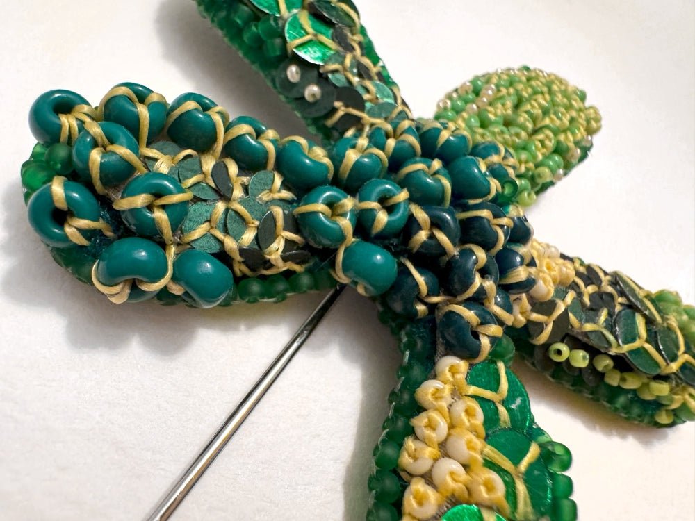 Sculptural handmade brooch inspired by organic forms created with free-flow beadwork in layered greens with yellow accents - Ornamentico shop