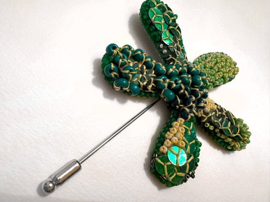 Sculptural handmade brooch inspired by organic forms created with free-flow beadwork in layered greens with yellow accents - Ornamentico shop