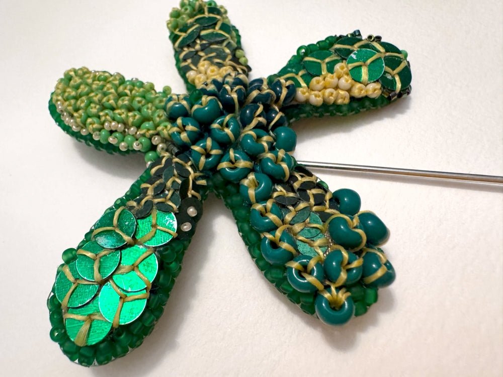 Sculptural handmade brooch inspired by organic forms created with free-flow beadwork in layered greens with yellow accents - Ornamentico shop