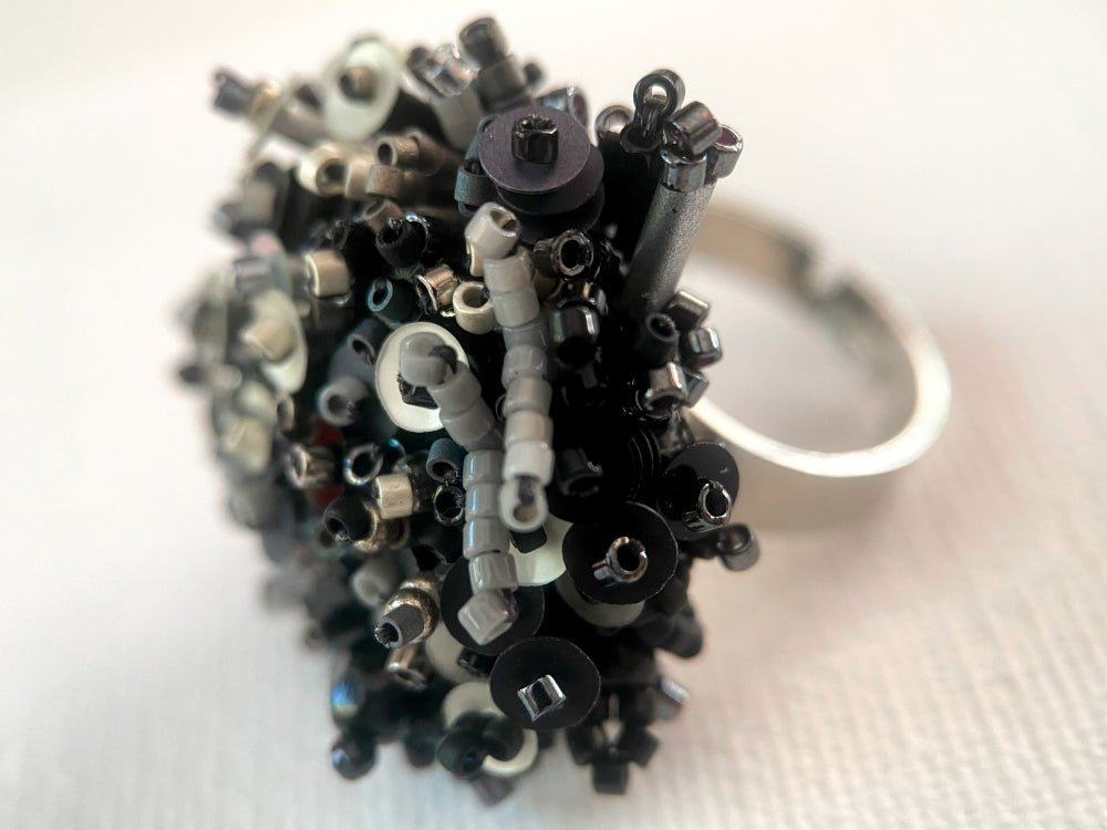 Handmade volume-beaded statement ring with floral design in classic black tones - Ornamentico shop