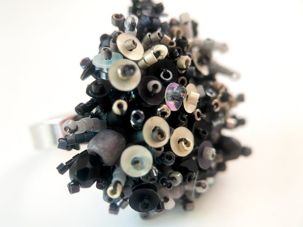 Handmade volume-beaded statement ring with floral design in classic black tones - Ornamentico shop