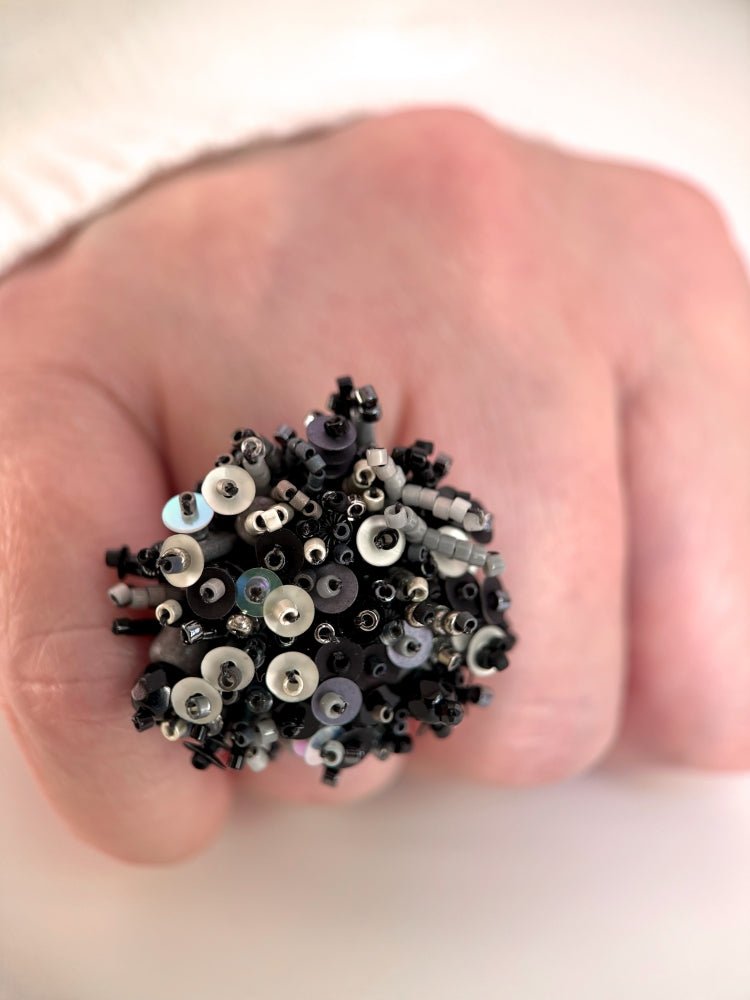 Handmade volume-beaded statement ring with floral design in classic black tones - Ornamentico shop