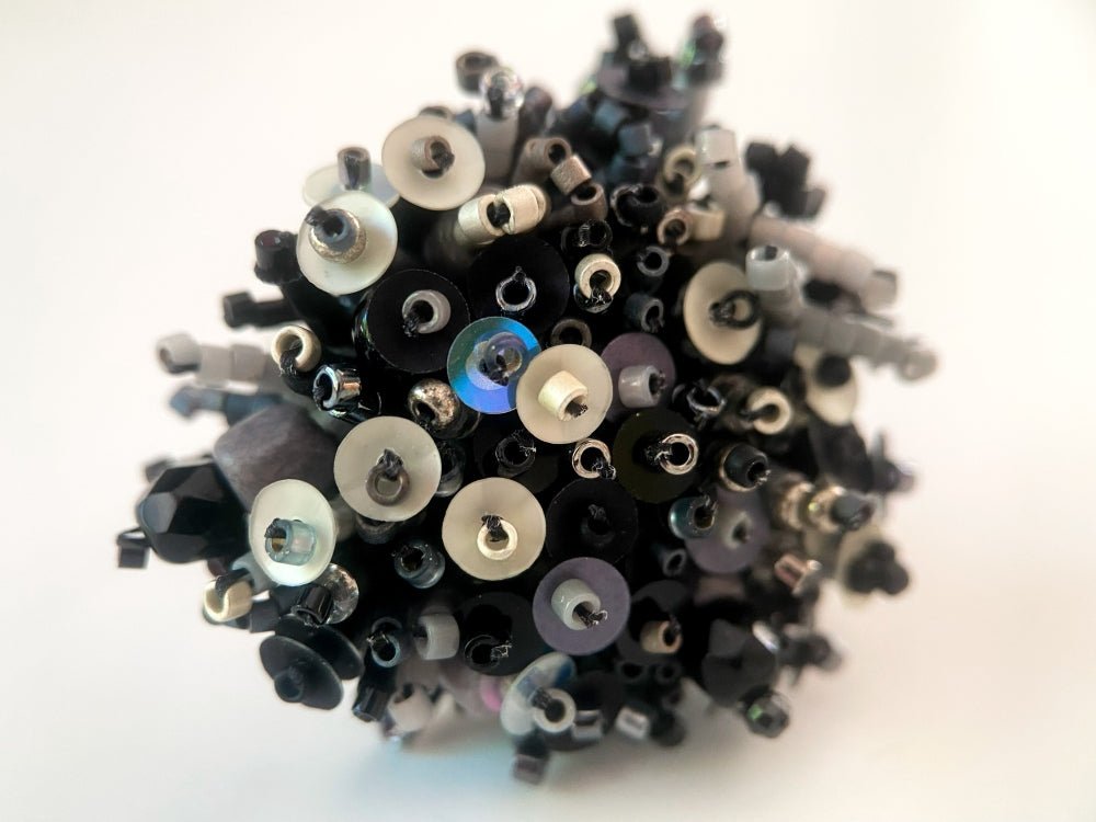 Handmade volume-beaded statement ring with floral design in classic black tones - Ornamentico shop