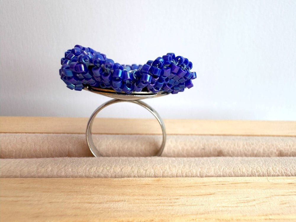 Handcrafted sculptural beaded ring shaped like a blue clematis flower - Ornamentico shop