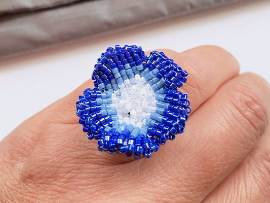 Handcrafted sculptural beaded ring shaped like a blue clematis flower - Ornamentico shop