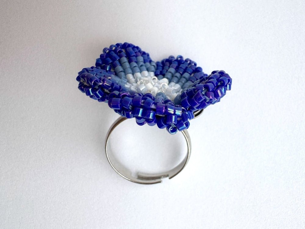 Handcrafted sculptural beaded ring shaped like a blue clematis flower - Ornamentico shop