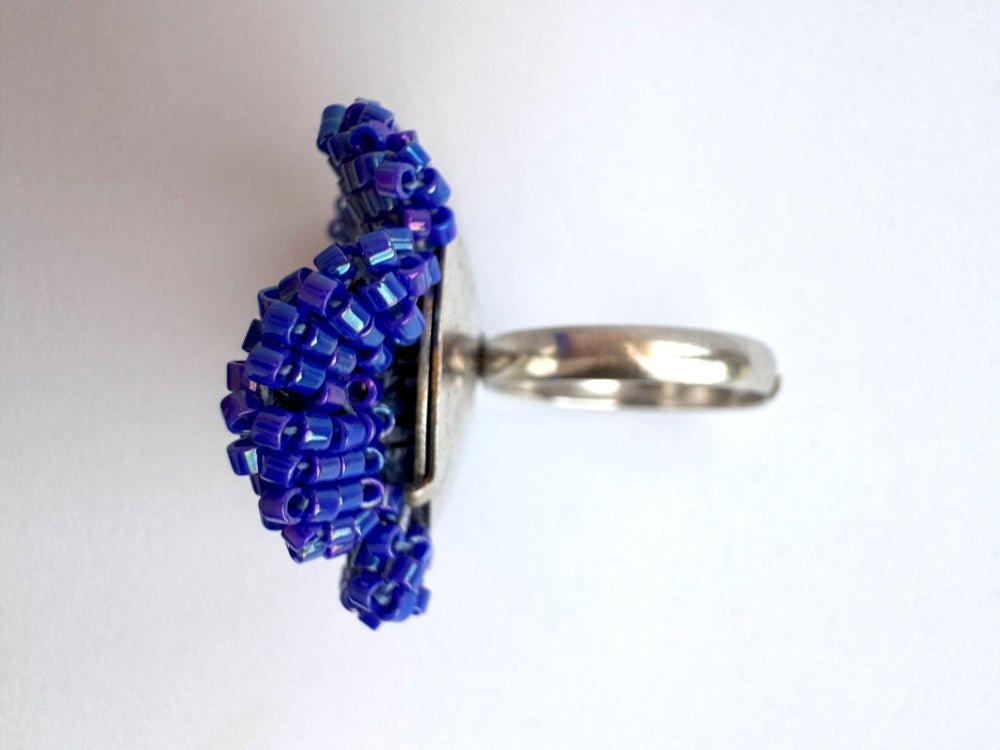 Handcrafted sculptural beaded ring shaped like a blue clematis flower - Ornamentico shop