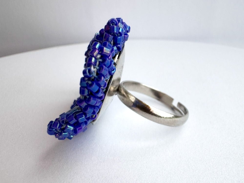 Handcrafted sculptural beaded ring shaped like a blue clematis flower - Ornamentico shop