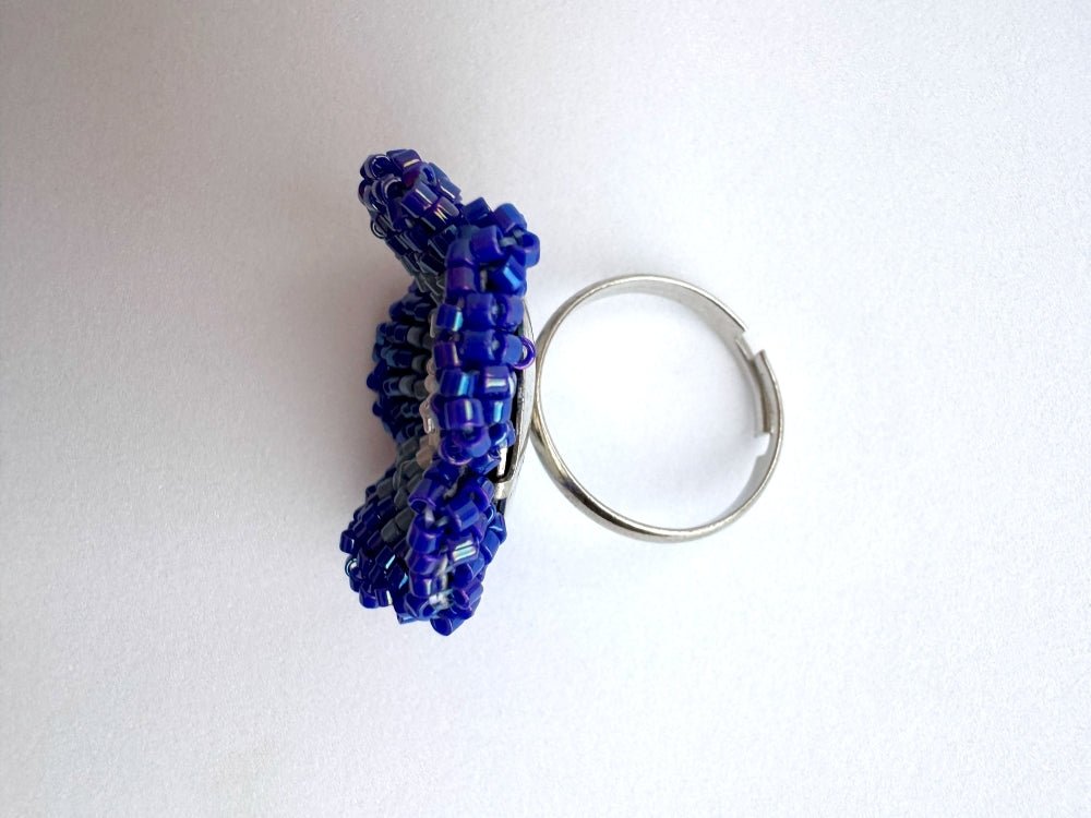Handcrafted sculptural beaded ring shaped like a blue clematis flower - Ornamentico shop