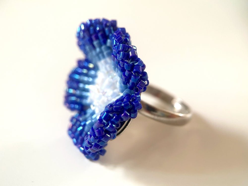 Handcrafted sculptural beaded ring shaped like a blue clematis flower - Ornamentico shop