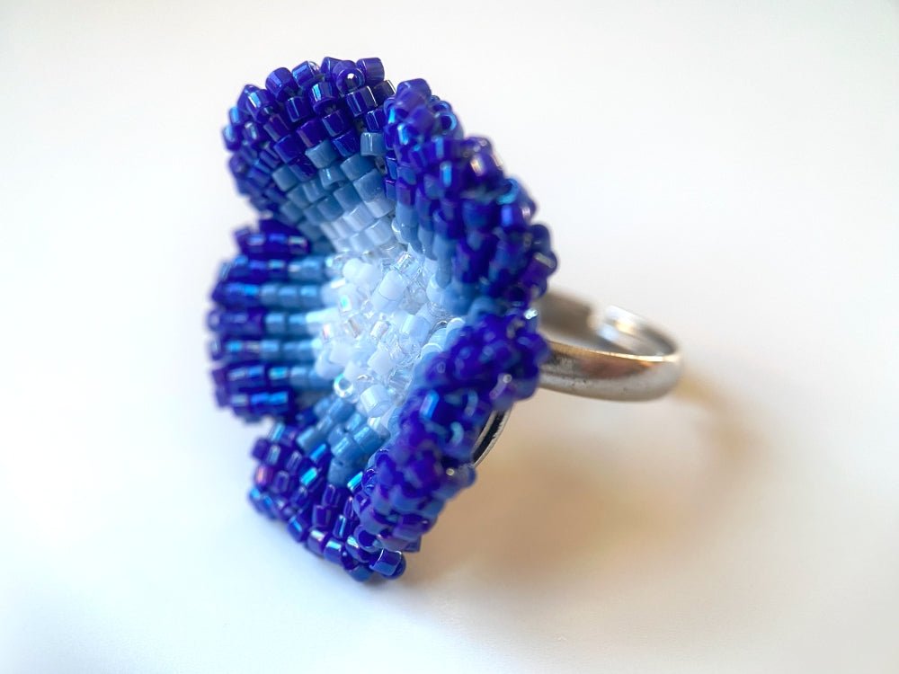 Handcrafted sculptural beaded ring shaped like a blue clematis flower - Ornamentico shop
