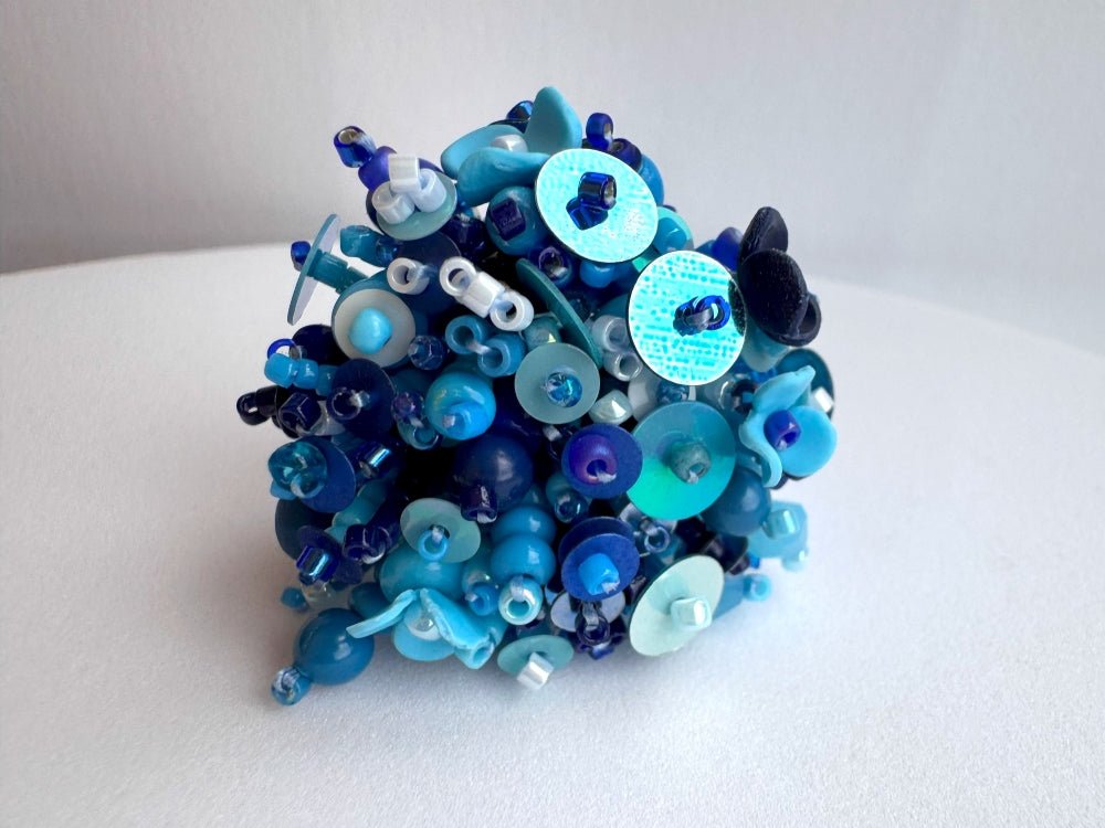 Handmade volume-beaded statement ring with floral design, polymer clay & sequins in blue hues - Ornamentico shop