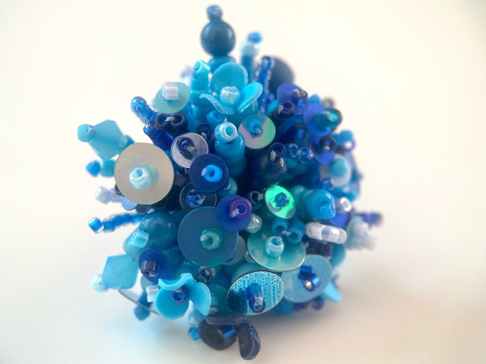 Handmade volume-beaded statement ring with floral design, polymer clay & sequins in blue hues - Ornamentico shop