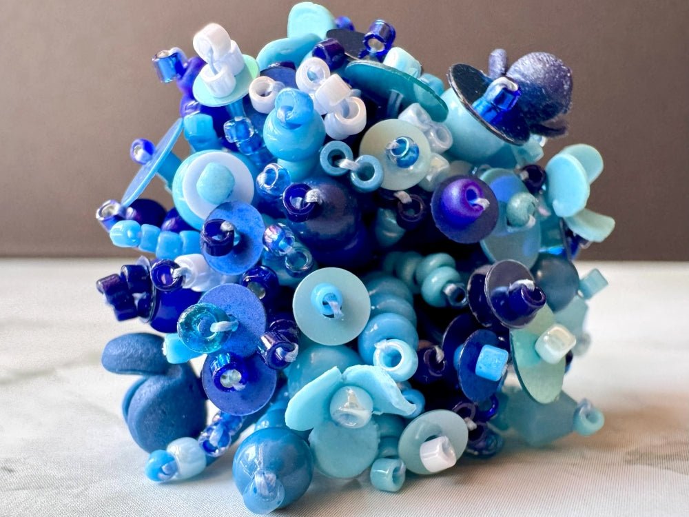 Handmade volume-beaded statement ring with floral design, polymer clay & sequins in blue hues - Ornamentico shop