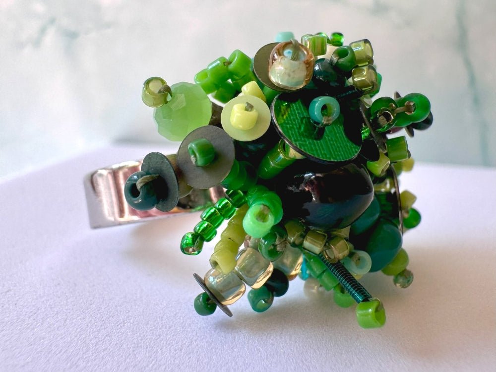 Handmade volume-beaded statement ring with floral design in a variety of green hues - Ornamentico shop
