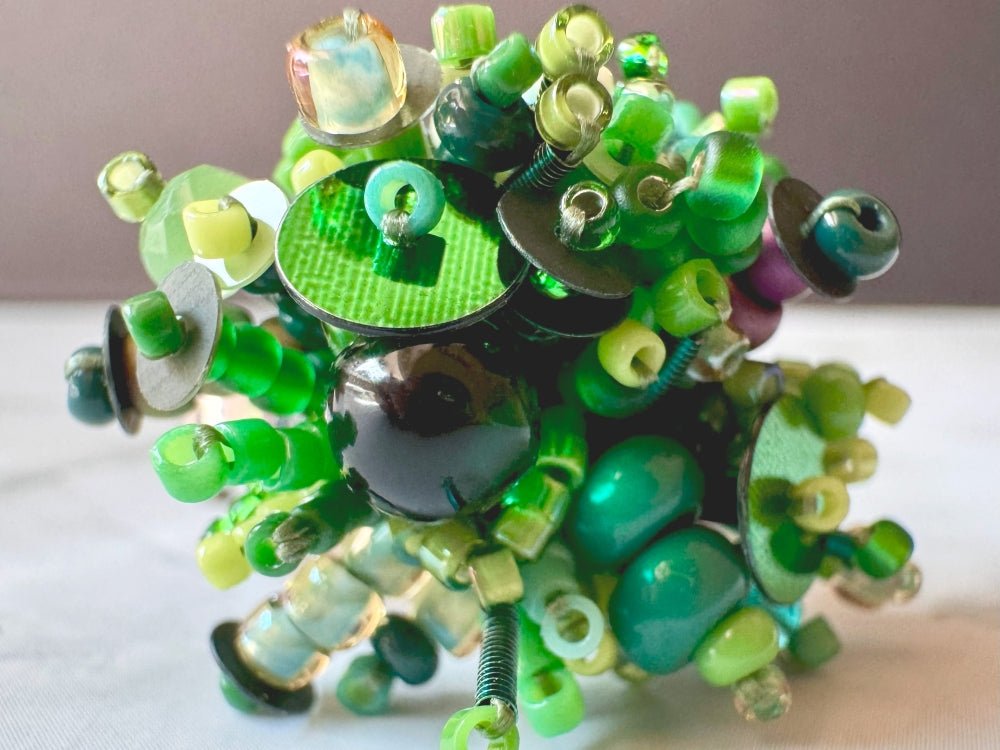 Handmade volume-beaded statement ring with floral design in a variety of green hues - Ornamentico shop