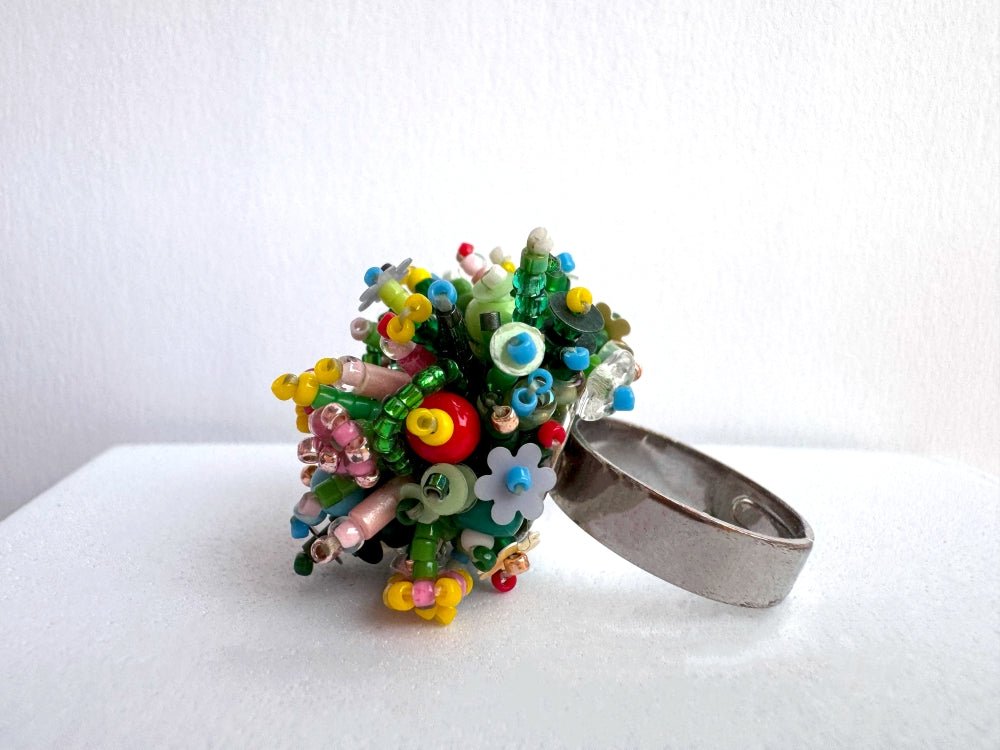 Handmade statement ring with volume beadwork in floral green and multicolor tones - Ornamentico shop