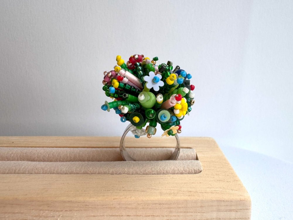 Handmade statement ring with volume beadwork in floral green and multicolor tones - Ornamentico shop