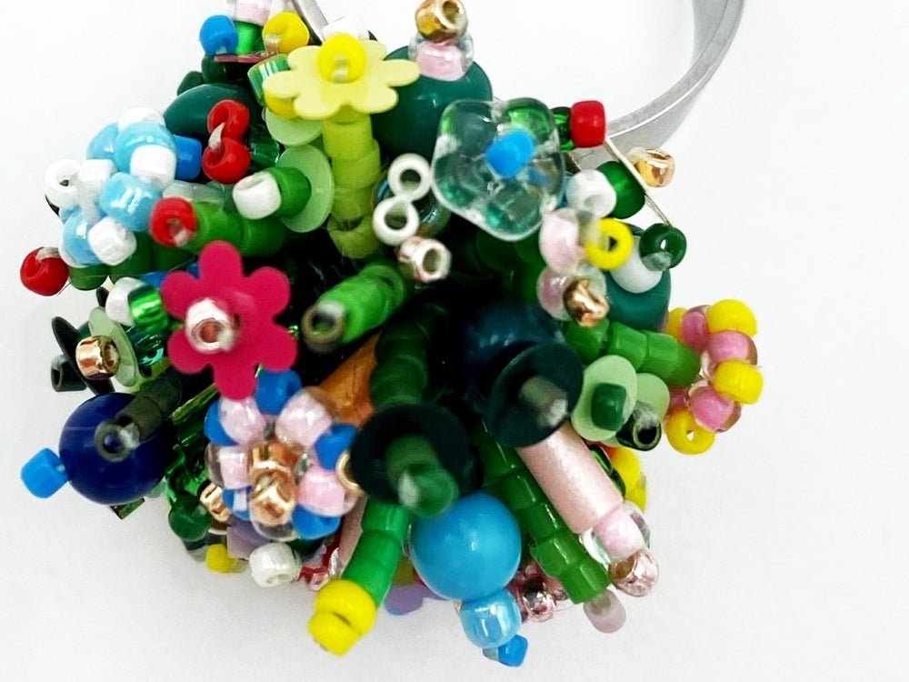 Handmade statement ring with volume beadwork in floral green and multicolor tones - Ornamentico shop