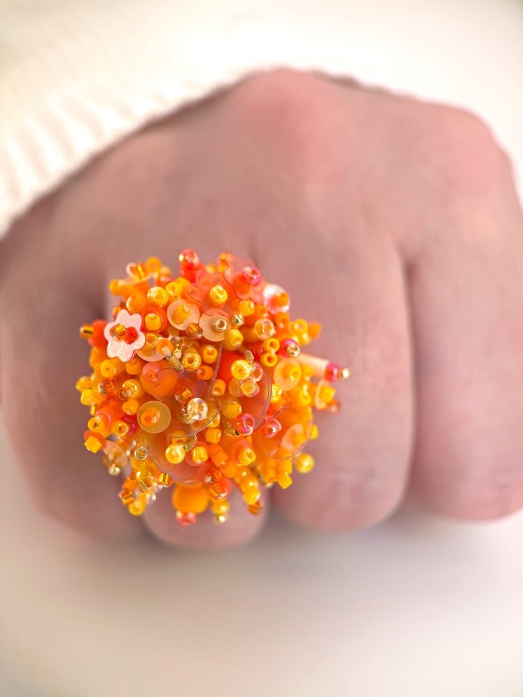 Colorful ring crafted in volume-beading technique from bright orange beads and sequins imitating a blossoming flowerbed - Ornamentico shop