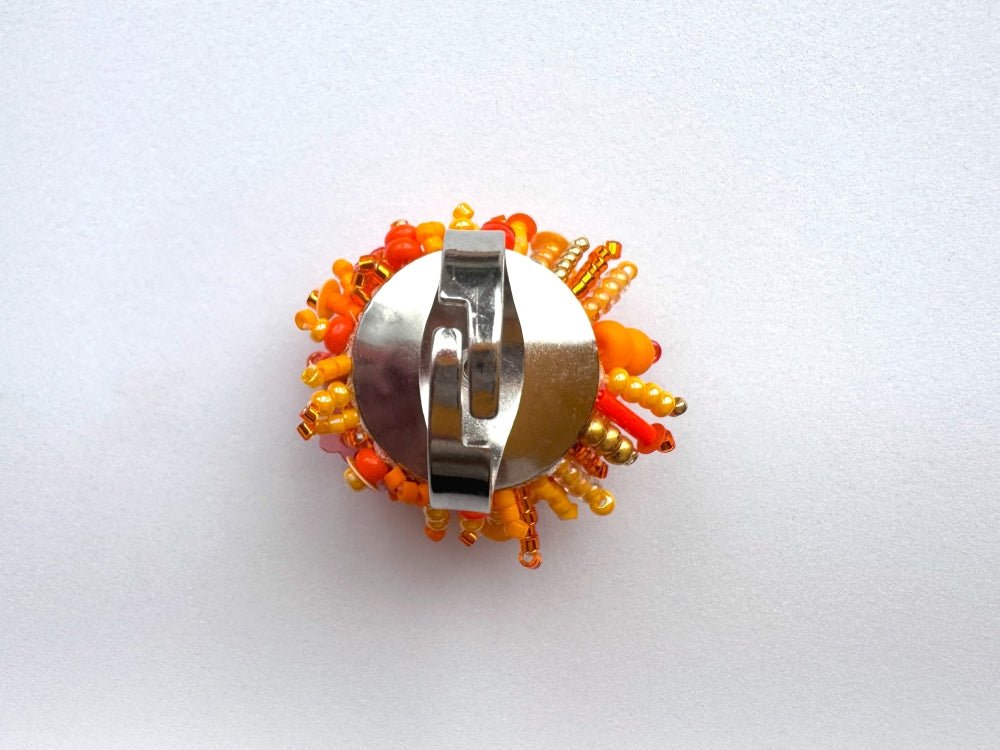 Colorful ring crafted in volume-beading technique from bright orange beads and sequins imitating a blossoming flowerbed - Ornamentico shop