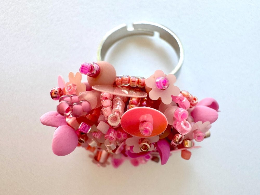 Handmade volume-beaded statement ring with floral design, polymer clay & sequins in pink hues - Ornamentico shop