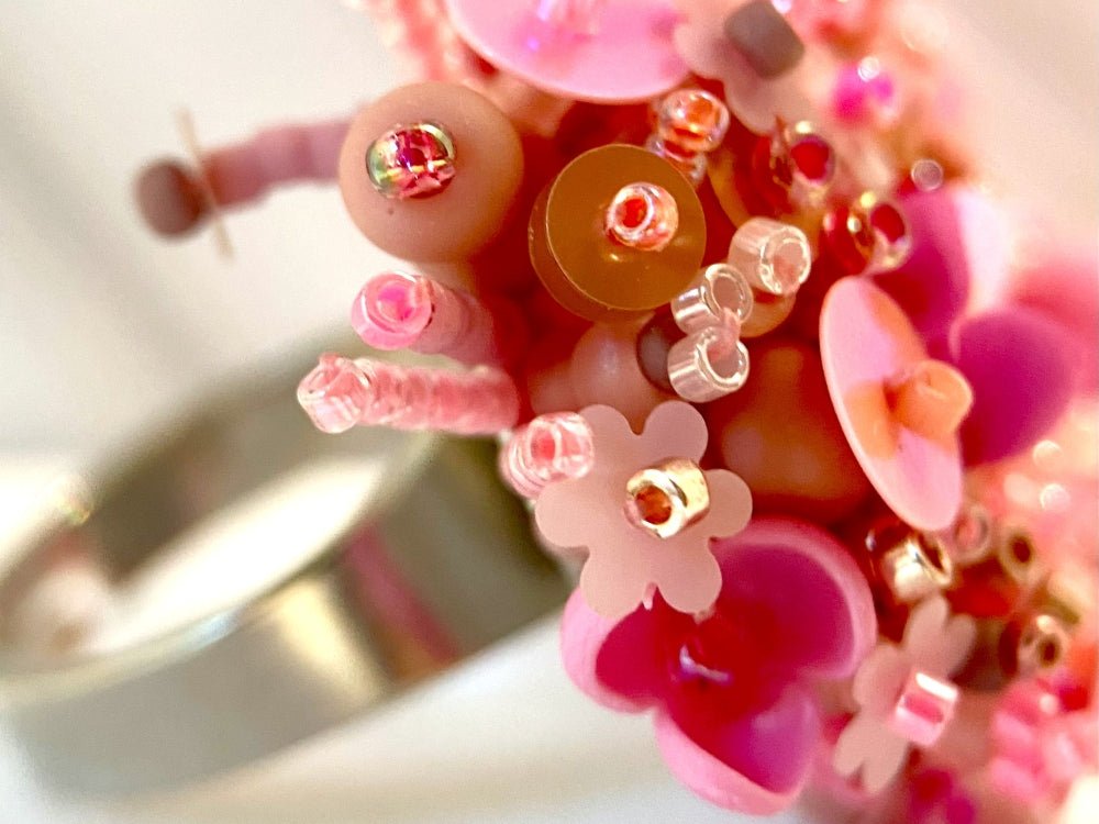 Handmade volume-beaded statement ring with floral design, polymer clay & sequins in pink hues - Ornamentico shop