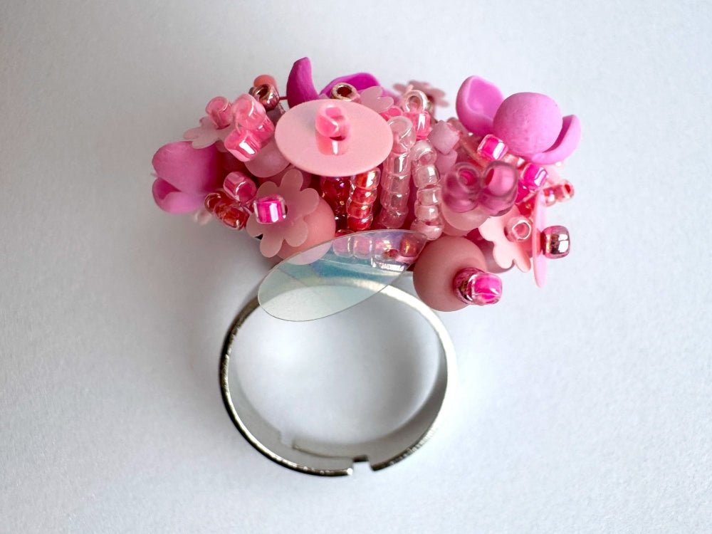 Handmade volume-beaded statement ring with floral design, polymer clay & sequins in pink hues - Ornamentico shop